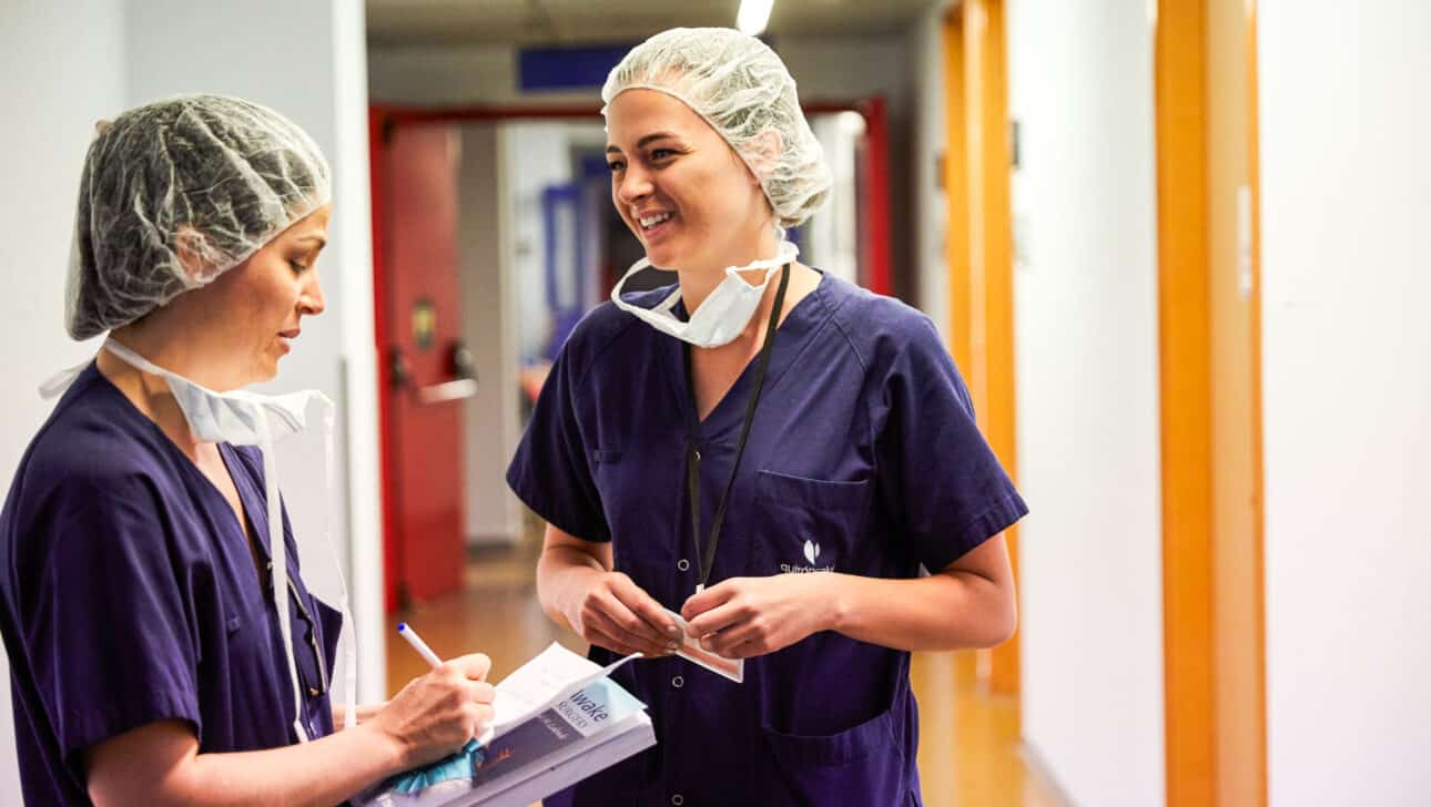 Students chatting in the hospital hallway