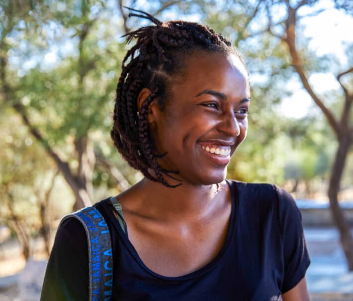 An Atlantis student smiling while shadowing abroad.