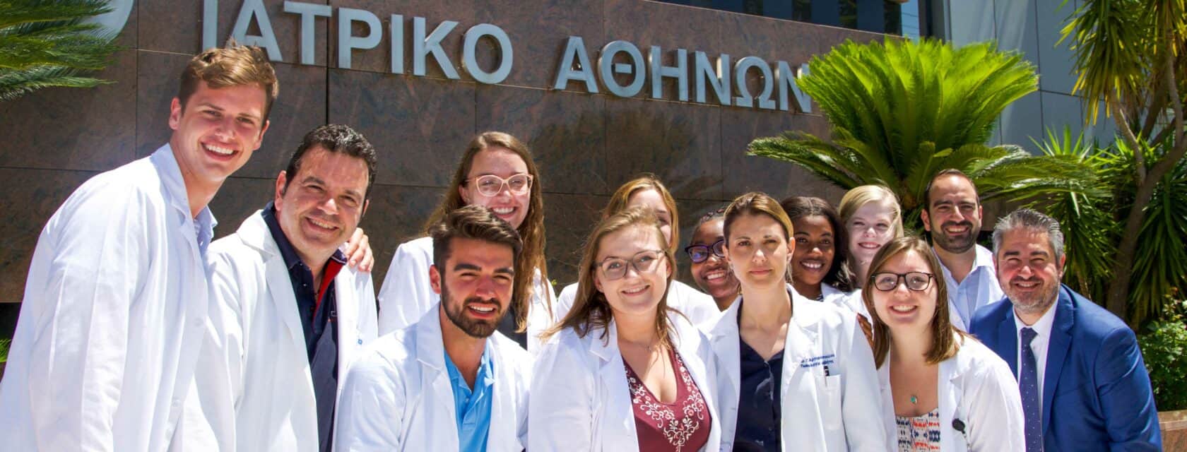 Atlantis students standing in front of a hospital.