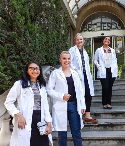 Students standing outside of the hospital where they are shadowing.