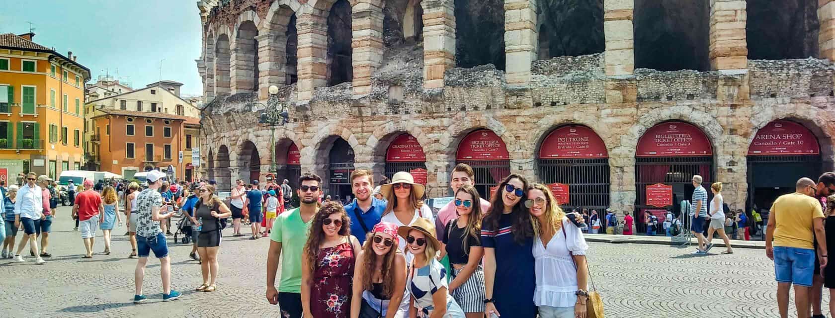 Atlantis students standing in front of a city landmark.