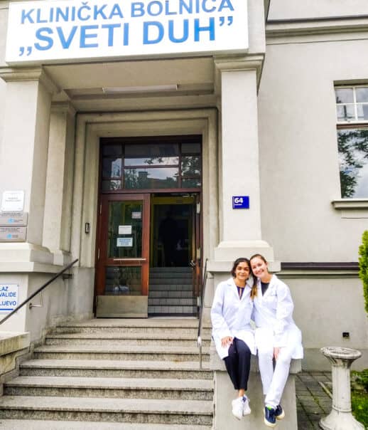 Students in front of the hospital where they are shadowing.