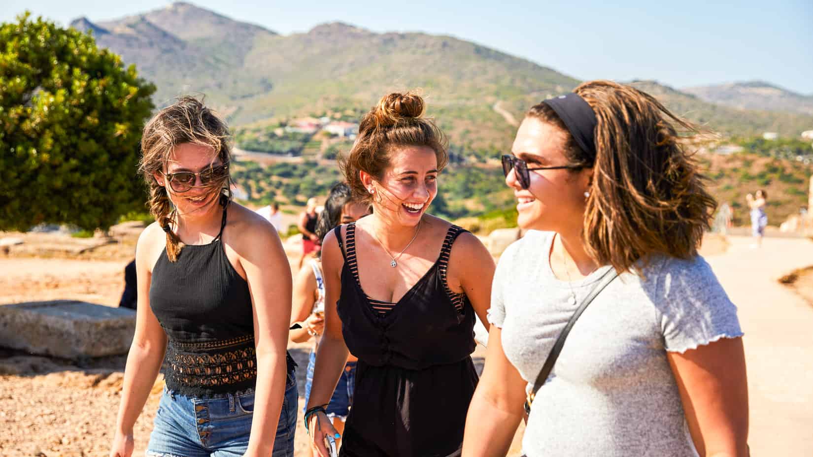 Students walking and smiling on an excursion.