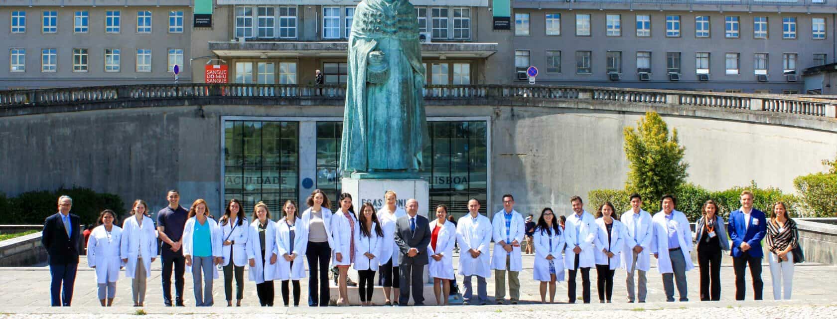 Students standing in front of the hospital where they will be shadowing.