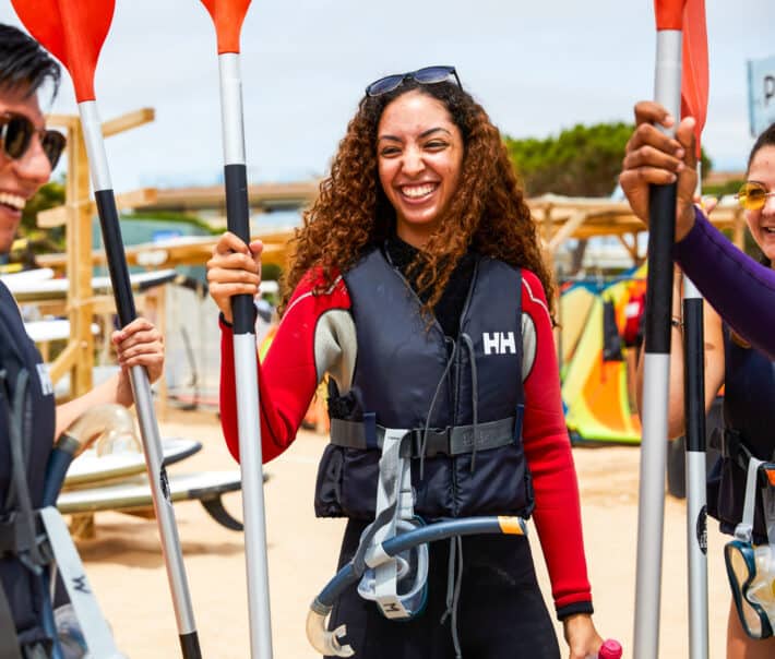 A student learning how to kayak.