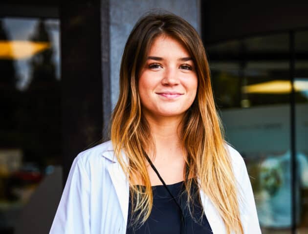 An Atlantis student standing outside the hospital where she is shadowing.