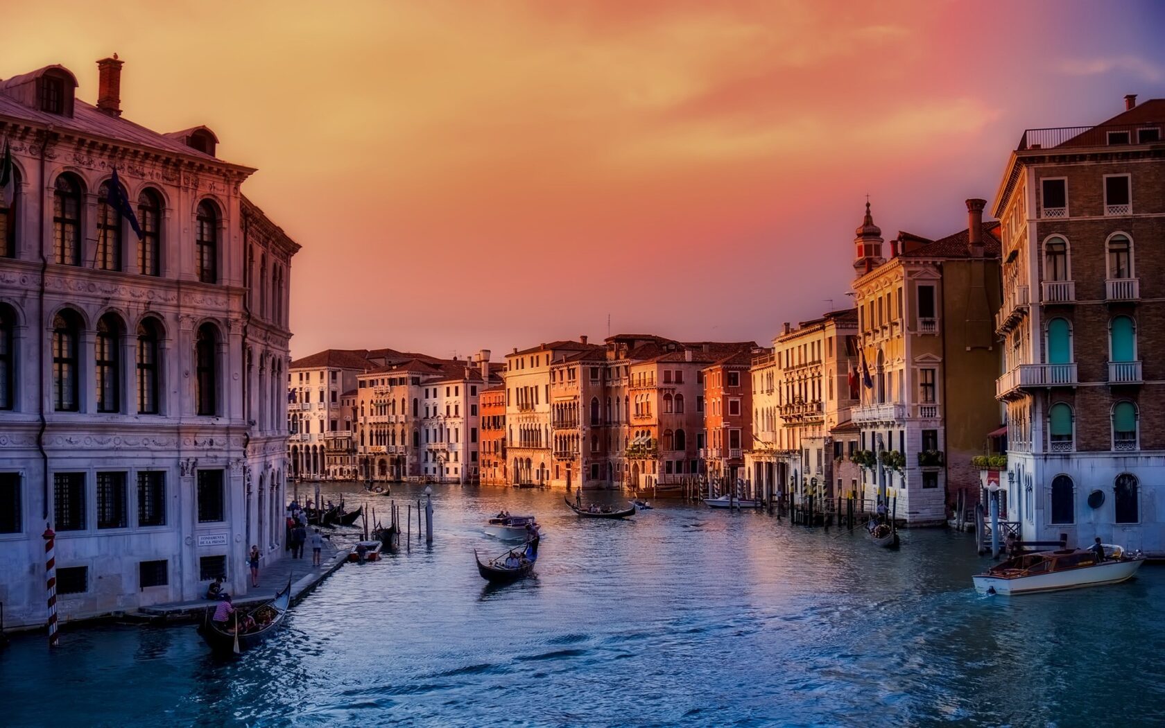 Canals with gondolas at sunset in Venice (an Atlantis site).