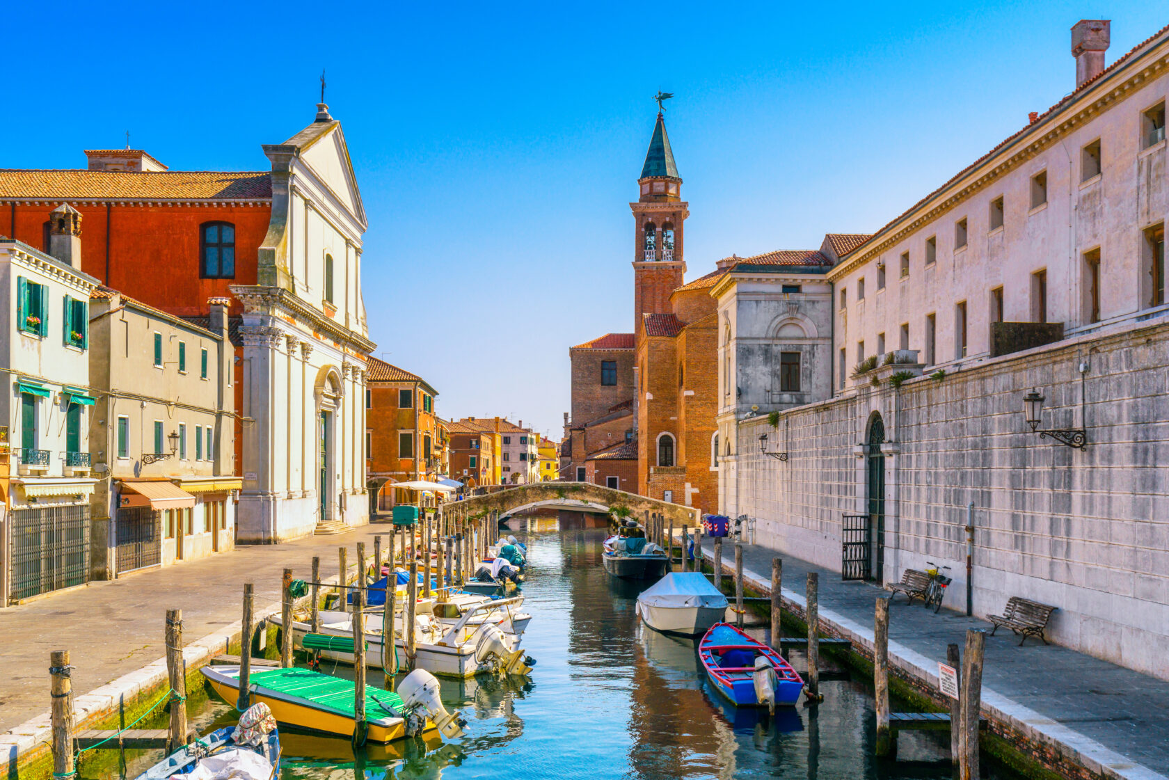 A view of a water canal and church in Chioggia, Italy, a town in the Venetian Lagoon (an Atlantis site).