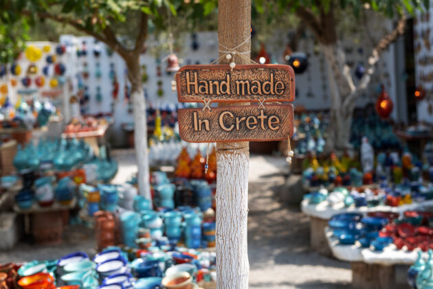 A 'handmade in Crete' sign hanging outside of a market in Crete, Greece.